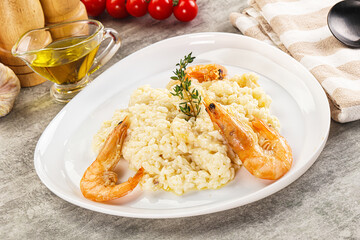 Italian risotto with prawn served thyme