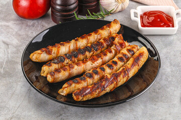 Grilled meat sausages wrapped bacon