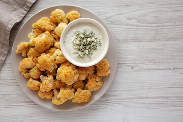 Homemade Buffalo Cauliflower with Blue Cheese Sauce, top view.