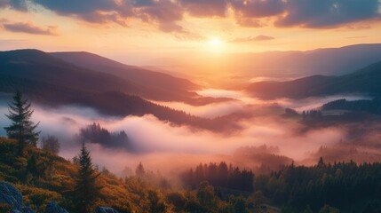 Naklejka premium hazy panorama of the landscape. Wonderfully surreal dawn on rugged peaks, offering a glimpse of the foggy valley beneath. cloud cover above the forest. A view of the fanciful countryside below. 