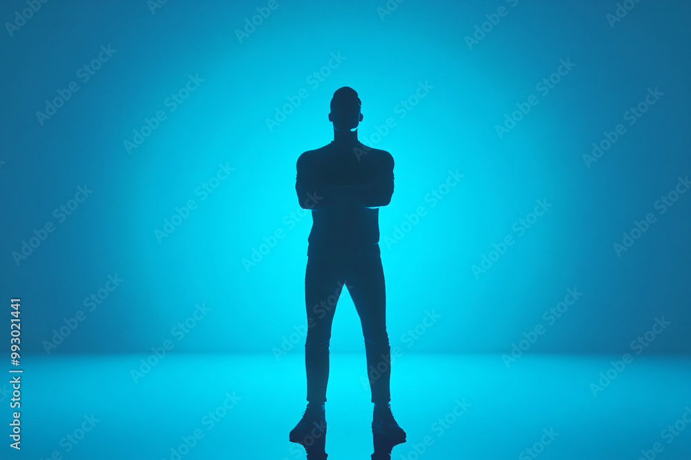 Poster silhouette of a person standing confidently against a blue backlit background creating a mysterious 
