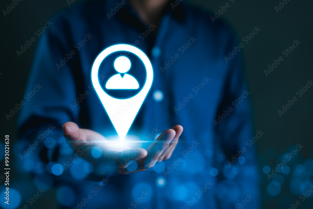 Wall mural targeted marketing and customer strategy concept. a person holds icon of a location marker with user