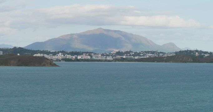 Noumea, capital city of New Caledonia, surrounded by mountains.
