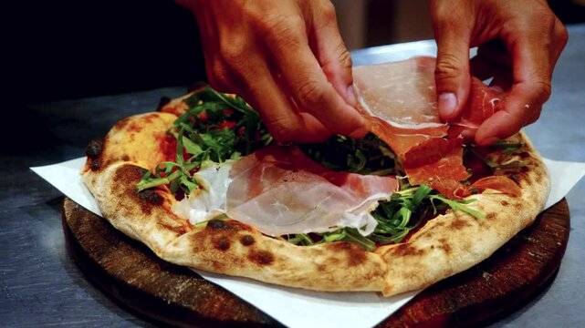 Authentic pizza making process in traditional Italian pizzeria, with the chef adding topings on the pizza