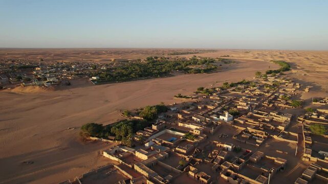 Chinguetti town surrounded by Sahara desert, Mauritania. Aerial backward
