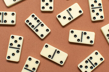 Dominoes bones on brown background	