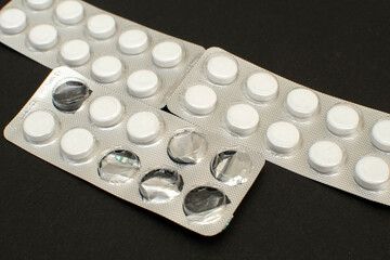 Medical drugs and pills in silver package	