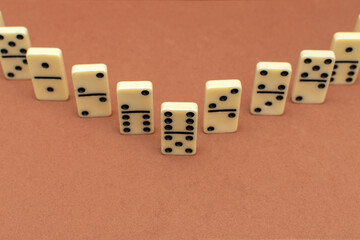 Dominoes bones on brown background	