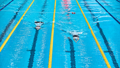 Athletes finish. Aquatics bifins sports. Athletes competing in blue swimming pool. Finswimming...