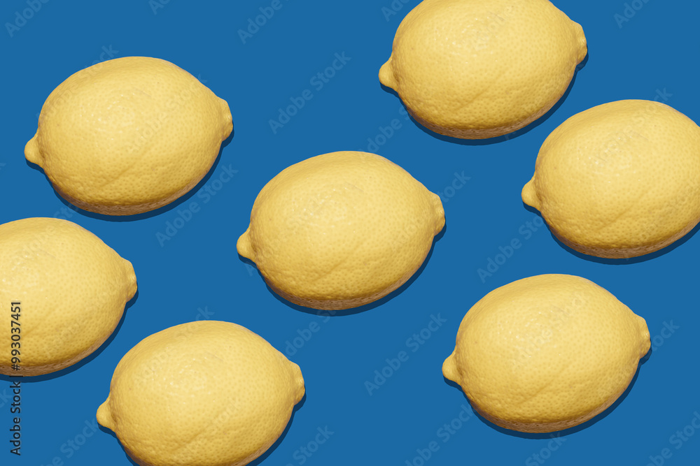 Wall mural pattern with a lemon on blue background