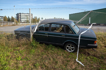 car crashed through chain-link fence