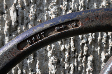 sprinkler system connections wheel detail outside of a building exterior wall