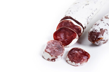 Fuet.Dry cured fuet sausage isolated on white background. Copy space