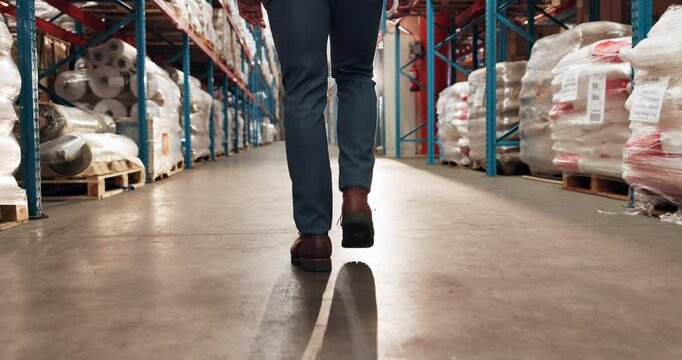 Man, legs or walking in warehouse for storage, food distribution or wholesale production. Back, factory worker and footsteps of supply chain supervisor in inspection, logistics or industrial shipping