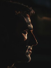 Intense Portrait of a Man in Half Shadow and Light