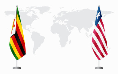Zimbabwe and Liberia flags for official meeting against background of world map.