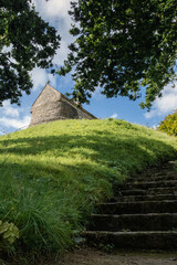 Low angle view of La Hougue Bie dolmen. A 16th–century neolithic christian chapel.
