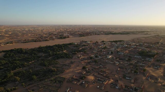 Chinguetti town surrounded by Sahara desert, Mauritania. Aerial drone panoramic view. Desertification concept