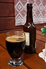 Dark beer in a glass on a table in a restaurant