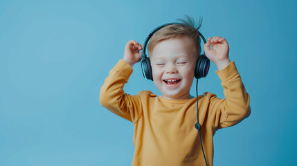 Joyful child in a bright yellow sweater enjoys music while dancing with headphones against a vibrant blue background