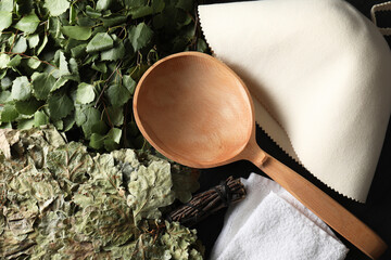 Sauna whisks, felt wool hat and wooden ladle on table, flat lay
