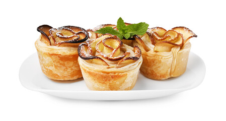 Freshly baked apple roses with mint isolated on white. Puff pastry