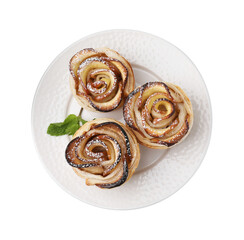 Freshly baked apple roses with mint isolated on white, top view. Puff pastry