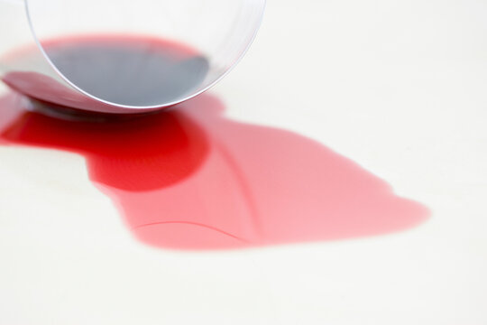 Close up of a glass with spilled red wine
