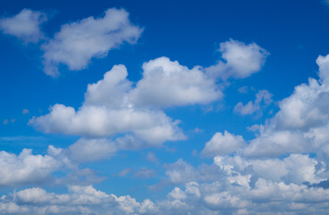Beautiful blue sky with white clouds forming on sunny day