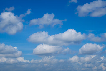 Beautiful blue sky with white clouds forming on sunny day
