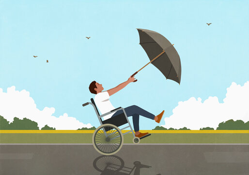 Man in wheelchair with umbrella blowing in wind along rural field
