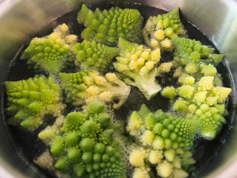 Close up romanesco cauliflower in cooking oil
