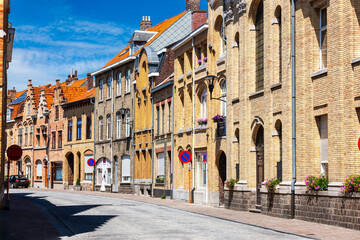 Buildings along Rijselstraat, street running through the town of Ypres, Ieper, Belgium.