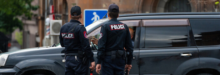 Police officers checking the car, official work process