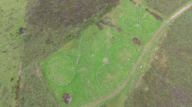 Aerial view of a group of women worshipping at the Beaghmore Stone circles at Blackrock Road by Cookstown in County Tyrone, Northern Ireland