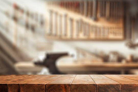 Craft workshop interior and empty work table with space for products.