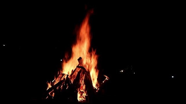 View loop of burning firewoods, bright firecamp with sparks at night, Camp fire in the night. Exploring the wildness travelling in outdoor