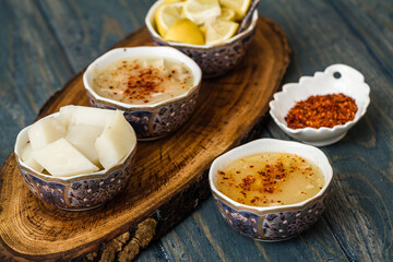 Traditional Arabasi soup, chicken based soup from the Turkish cuisine in ceramic bowls on a wooden board.