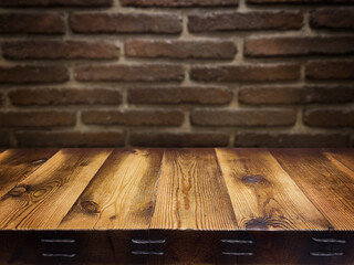An empty wooden countertop against a black brick wall. Home interior. Copy space
