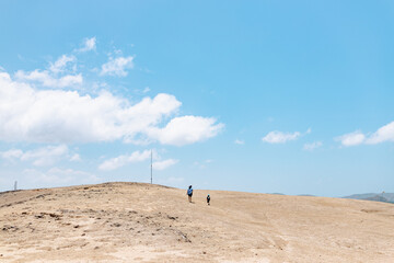 Mother and son walking on the hill in Lombok