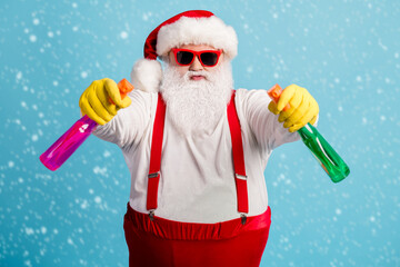 Portrait of his he nice attractive childish comic humorous overweight Santa cleaning up using...