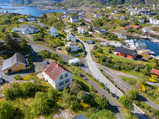 Aerial view, villagescape of Sorvagen in middle of rugged landscape. Lofoten district in Norway