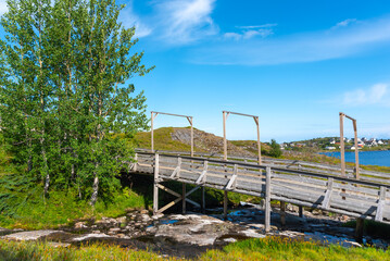 Wooden footbridge on hiking trail around Lake Sorvagvatnet near Sorvagen. Lofoten district in Norway