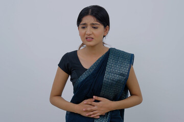 Indian Woman in Saree having Stomach Ache