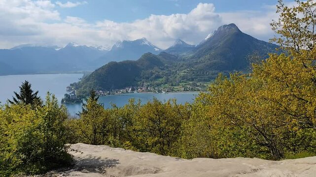 scenic landscape of mountains, duingt and Annecy lake seen from roc de Chere in Talloires, Haute Savoie, hd video, still
