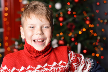 Portrait of an enthusiastic boy. Christmas surprises.
