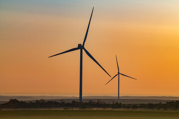 Two wind generators in early May morning. Rostov region, Russia