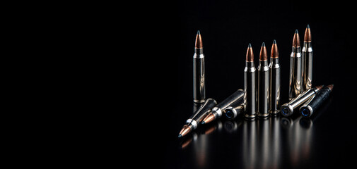 Bullet isolated on black background with reflexion. Rifle bullets close-up on black back....