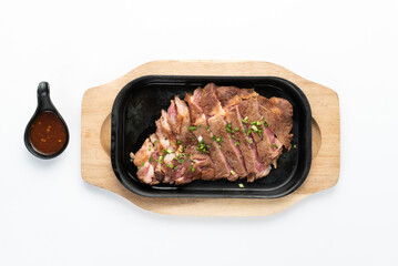 Delicious Grilled Meat on Wooden Platter with Sauce