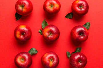 Many red apples on colored background, top view. Autumn pattern with fresh apple above view with copy space for design or text